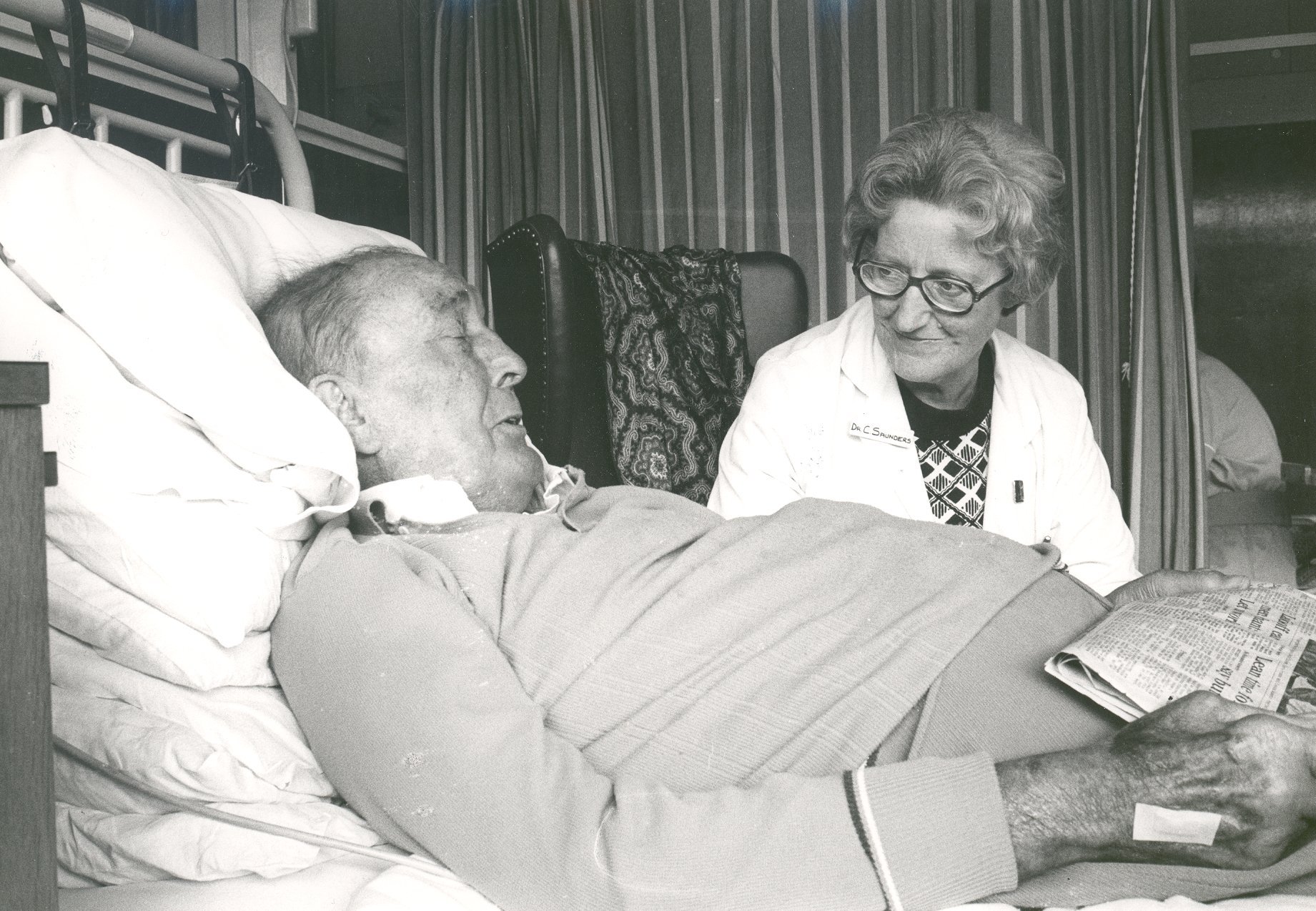 Dr-Saunders-with-patient1-2